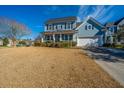 Inviting two-story home with manicured lawn, two car garage and classic architectural details at 101 Back Creek Ct, Summerville, SC 29485