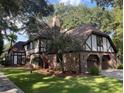 Elegant two-story home with brick and Tudor accents, plus a two-car garage at 104 Legend Oaks Way, Summerville, SC 29485