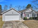 Inviting exterior view showcasing the home's architectural design and an attached two-car garage at 111 Pacolet St, Summerville, SC 29485