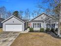 Picture of home's exterior with well-manicured lawn, providing great curb appeal and a welcoming entrance at 111 Pacolet St, Summerville, SC 29485