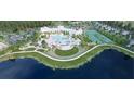 Aerial view of the community's resort-style pool, tennis courts, clubhouse, and well-manicured walking paths at 1140 Darling St, Summerville, SC 29485