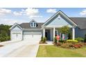 Charming single-Gathering home featuring a well-manicured lawn, a two car garage and welcoming curb appeal at 1140 Darling St, Summerville, SC 29485