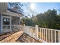 View from the wooden deck with white railing leading up to the screened in porch at 1217 Bamboo Dr, Charleston, SC 29407
