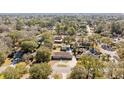 An aerial shot of the home in a peaceful neighborhood surrounded by lush trees and well-maintained properties at 1288 Old Colony Rd, Mount Pleasant, SC 29464