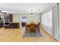 Inviting dining area featuring hardwood floors, modern lighting, and neutral paint at 1288 Old Colony Rd, Mount Pleasant, SC 29464