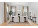 Elegant dining room featuring modern decor, hardwood floors, and large windows at 1328 Upper Union Rd, Mount Pleasant, SC 29464