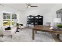 Bright home office features stylish decor, window, and contemporary furnishings at 148 Royal Cainhoy Way, Huger, SC 29450