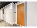 Hallway featuring room number 714 with gray patterned carpet and overhead lighting at 150 Bee St # 714, Charleston, SC 29401