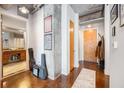 Inviting hallway entrance with modern lighting, concrete accents, and convenient bathroom access at 150 Bee St # 714, Charleston, SC 29401