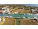 A landscape aerial view shows the nearby waterway at 232 Haddrell St, Mount Pleasant, SC 29464