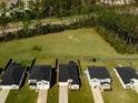 Aerial view of homes with fenced yards, green spaces, and proximity to a wooded area at 269 Firewheel Ct, Summerville, SC 29486