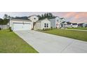 Charming single-Gathering home featuring a well-manicured lawn and an attached two-car garage at 269 Firewheel Ct, Summerville, SC 29486
