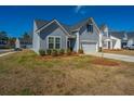 Well-maintained two-story home showcasing attractive siding and a neatly kept lawn in a friendly neighborhood at 317 Catawba Branch Way, Moncks Corner, SC 29461