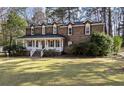 Charming brick home with a welcoming front porch and well-manicured lawn, perfect for Gathering living at 405 Huntington Rd, Summerville, SC 29483