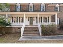 Close-up of the home's front entrance with brick stairs, showcasing its inviting curb appeal at 405 Huntington Rd, Summerville, SC 29483