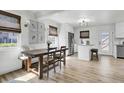 Eat-in dining area with wood table, stylish lighting, stainless steel fridge and bright natural light at 415 Parkdale Dr # 8A, Charleston, SC 29414
