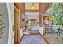 Welcoming foyer featuring hardwood floors, a staircase, and elegant decor at 522 W Butternut Rd, Summerville, SC 29483