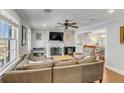 Cozy living room with a fireplace, hardwood floors, and neutral decor at 74 6Th Ave, Charleston, SC 29403