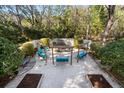 Charming backyard retreat with swing set, pea gravel and garden beds at 8834 Palmetto Rd, Edisto Island, SC 29438