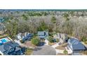 Aerial view of a neighborhood featuring a home with lush landscaping and mature trees at 107 Plank Ct, Summerville, SC 29485