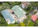 An aerial view showcases this home's backyard patio with an outdoor dining and lounge area at 111 S Battery St, Charleston, SC 29401