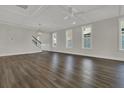 Spacious living room featuring hardwood floors, ceiling fan, and staircase access at 117 Grange Cir, Summerville, SC 29486