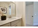 Clean bathroom with a vanity, framed mirror, and modern fixtures at 123 Grange Cir, Summerville, SC 29486