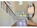 Grand foyer with high ceilings, elegant staircase, and natural light at 123 Grange Cir, Summerville, SC 29486