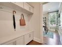 Mudroom with built-in storage and an umbrella, connected to an office at 123 Grange Cir, Summerville, SC 29486