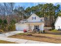 Lovely one-story home with front porch and flowering bushes at 1601 Thin Pine Dr, Johns Island, SC 29455