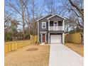 Two-story house with gray siding, white trim, and front yard landscaping at 2008 Emden St, North Charleston, SC 29406