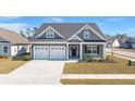 Charming single-Gathering home with a two-car garage, manicured lawn, and inviting craftsman-style facade at 224 Fiddleback Dr, Summerville, SC 29486