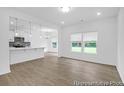 Bright living space featuring wood floors and an open layout connecting to the modern kitchen at 224 Night Heron St # 629, Summerville, SC 29486