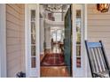 Grand foyer featuring an open doorway, hardwood floors, and a view of the staircase at 3009 Macbeth Creek Dr, Charleston, SC 29414