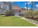 Inviting traditional home with a lovely front yard and a cozy, covered porch at 3009 Macbeth Creek Dr, Charleston, SC 29414