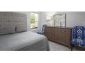 Cozy bedroom with a large window, a comfy bed, and stylish decor at 315 Pine Crest View Dr, Summerville, SC 29486