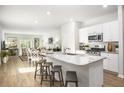 Open-concept kitchen with a granite island, stainless steel appliances, and bar stool seating at 315 Pine Crest View Dr, Summerville, SC 29486