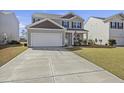 Traditional home with a well-manicured lawn and a spacious driveway offers comfortable suburban living at 433 Cedarview Rd, Summerville, SC 29486
