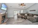 Inviting living room features a cozy brick fireplace and vaulted ceilings at 613 Salterton St, Summerville, SC 29485