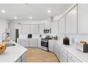 Modern kitchen featuring white cabinetry, stainless steel appliances, quartz countertops and lots of cabinet space at 1010 Swamp Rose Run, Summerville, SC 29485
