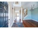 Inviting foyer with hardwood floors, staircase, and views into other rooms of the home at 109 Walnut Creek Rd, Charleston, SC 29414