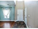 Bright foyer featuring tiled floors, a large window, and a white front door at 109 Walnut Creek Rd, Charleston, SC 29414