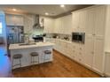 Modern kitchen with stainless steel appliances, quartz countertops, and island seating at 148 Cowrie Ct, Mount Pleasant, SC 29464
