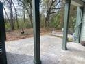 Private patio featuring stylish stone pavers and wooded views at 148 Cowrie Ct, Mount Pleasant, SC 29464