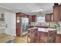 Spacious kitchen with granite countertops, stainless steel appliances, and dark wood cabinetry at 1562 Burnswick Dr, Johns Island, SC 29455