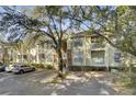 Exterior of a residential building with multiple balconies and assigned parking spaces at 1600 Long Grove Dr # 1727, Mount Pleasant, SC 29464