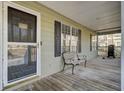 Relax on this inviting porch with seating area, and an easy access door to welcome guests into the home at 223 Fox Field Rd, Walterboro, SC 29488