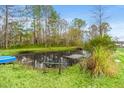 Picturesque pond with clear water, featuring a small pier, providing a tranquil setting at 2285 Cooper Store Rd, Moncks Corner, SC 29461