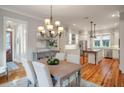 Dining area with a chandelier, with views of the kitchen and front entry at 3699 Codorus Ct, Mount Pleasant, SC 29466