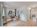 Dining area with a table, surfboard decoration, and ample natural light at 4336 Purdue Dr, North Charleston, SC 29418
